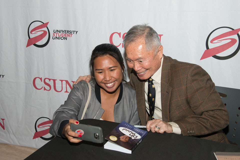 Student takes a selfie with George Takei.