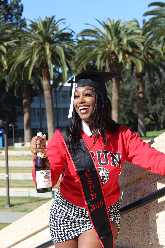 Taniya Armstrong, Psychology/Religious Studies major, poses with non-alcoholic sparkling cider.