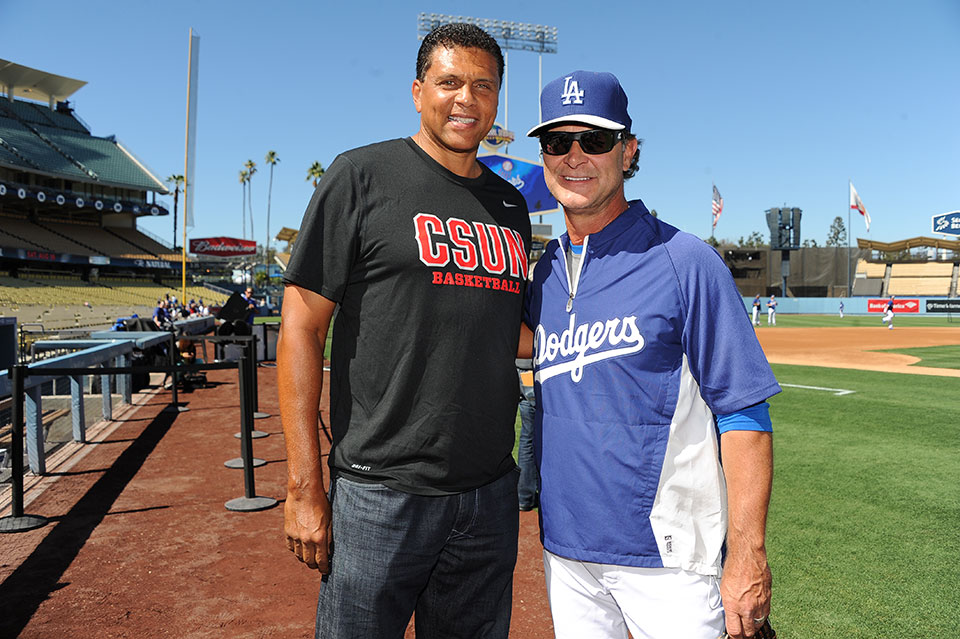 Dodger manager Don Mattingly and Theus.