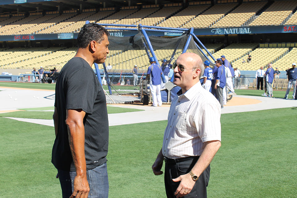 Stan Kasten and Theus catch up.