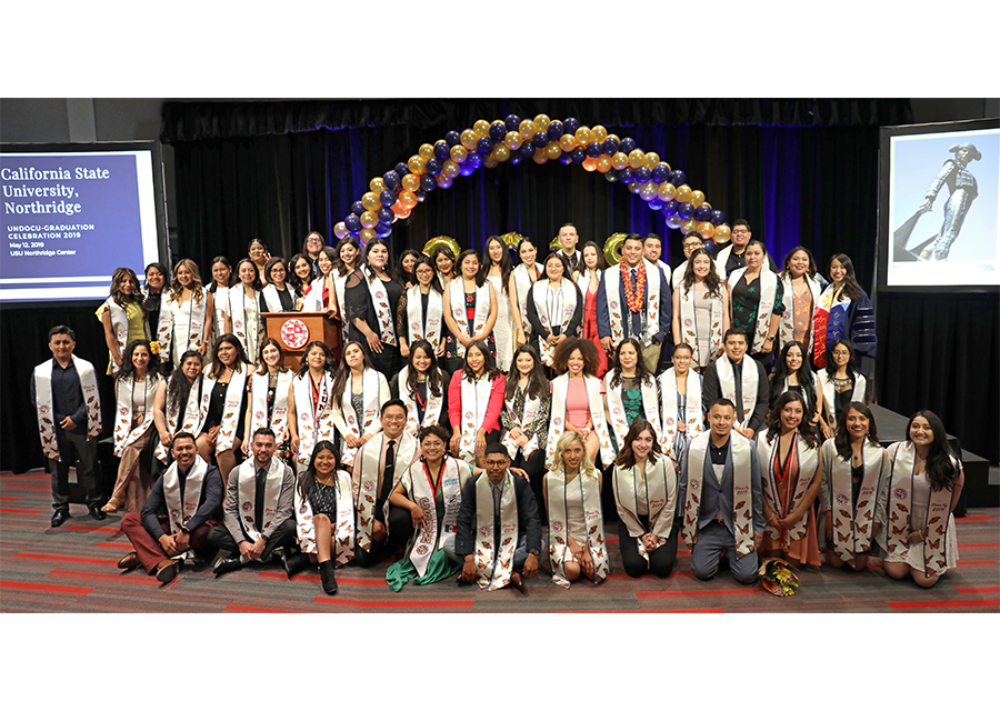 CSUN's graduating undocumented students and students from mixed-status families smile for a group photo during the Undocu-Graduation Celebration 2019 on May 12 at the Northridge Center.