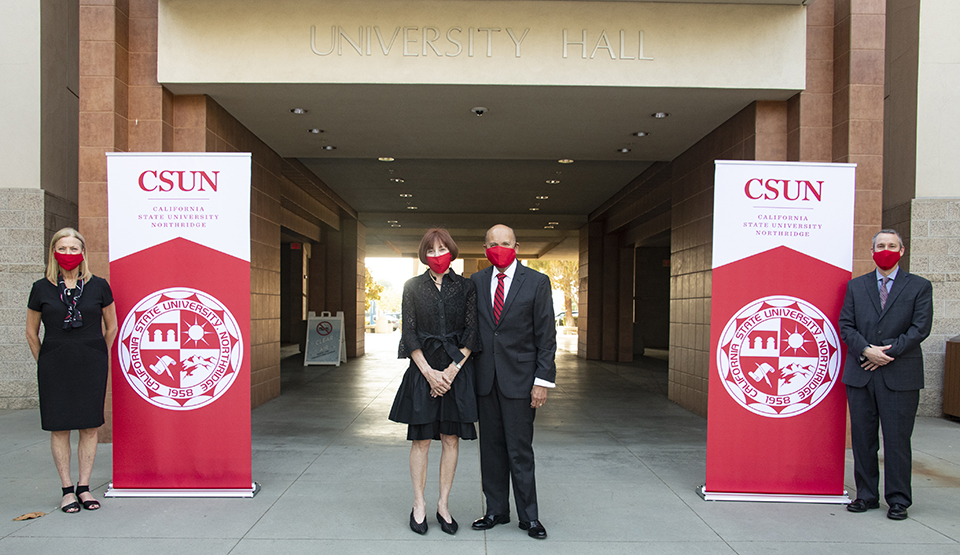 From left, CSUN President Dianne F. Harrison, Debbie Valera, Milt Valera and CSUN Vice President for University Relations and Advancement Robert D. Gunsalus in front of CSUN's administration building, now called Valera Hall. Photo by Lee Choo.