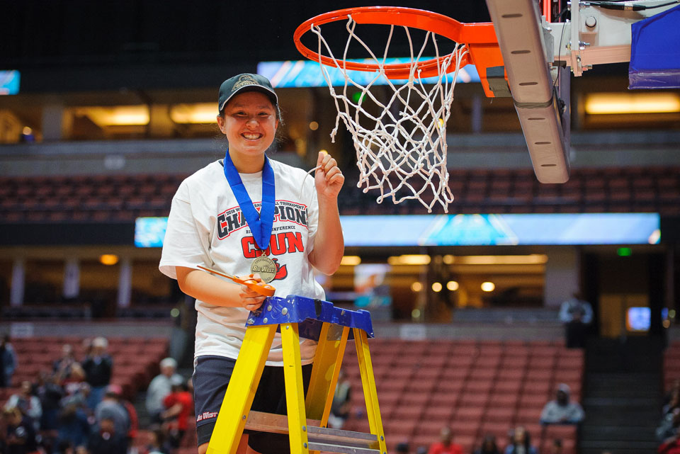 Hayley Tanabe cuts down the net.