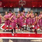 CSUN women's basketball team wearing pink jerseys.
