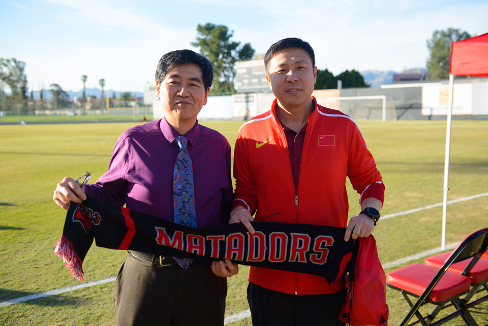 Provost Yi Li with Chinese national team official.