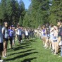 Two rows of students are lined up to take part in an outdoor team activity at Ponderosa Pines Camp.