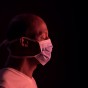 Side portrait of african american man with protective mask stock photo