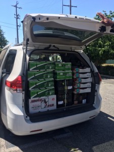 A minivan loaded with boxes of fresh fruit and vegetables to be distributed to the community as part of the CalFresh Healthy Living initiative's pop-up food distribution program. Photo courtesy of Viridiana Ortiz.