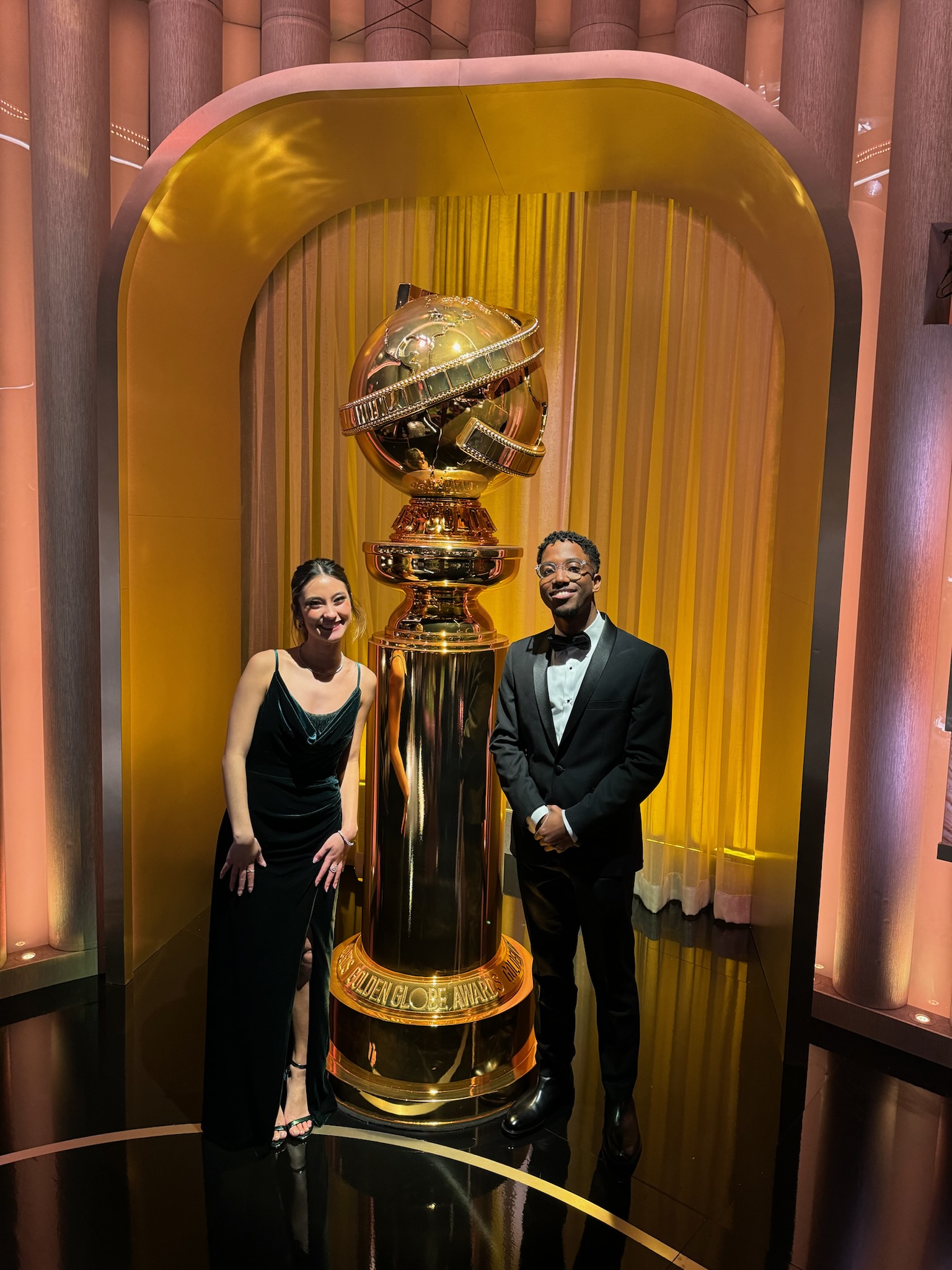 Elardo and Marshall with the Golden Globes statue at the awards ceremony.