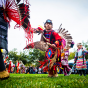 A child dances in American Indian regalia at the 2019 CSUN Powwow.