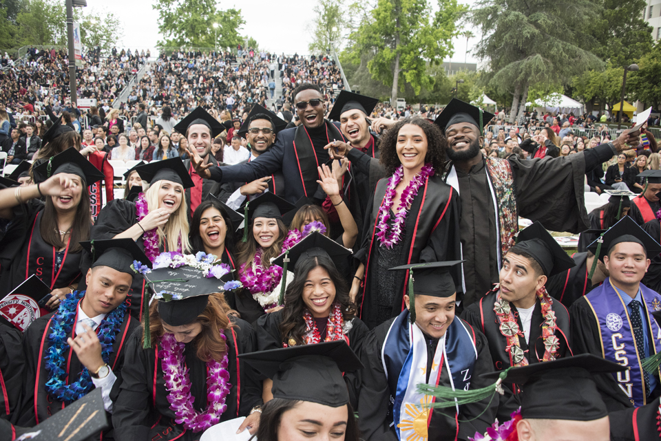 CSUN students celebrate with a group photo at commencement.