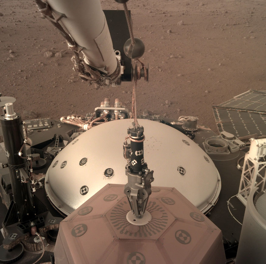 A photo of the InSight lander's robotic arm and equipment on Mars' surface. Photo courtesy of NASA/JPL-Caltech.