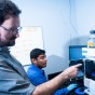 CSUN Professor Gilberto Flores and graduate student Luis Duran work with High-Performance Liquid Chromatography system (HPLC), which arrived at CSUN in May.