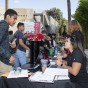 A new CSUN student checks in at a table for New Student Orientation.