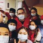 A group of CSUN nursing students in scrubs and masks pose for a photo at USC Verdugo Hills.