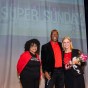 Gigi McGuire, CSUN assistant director of community and academic partnerships; Charles Humphrey, pastor of H.O.P.E.’s House Christian Ministries; and CSUN President Dianne F. Harrison., on stage at the church.