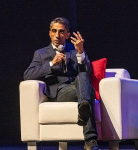Utpal Mangla, vice president and senior partner at IBM, sits in a chair and holds a microphone, speaking at a Nazarian College "Workforce of the Future" symposium.